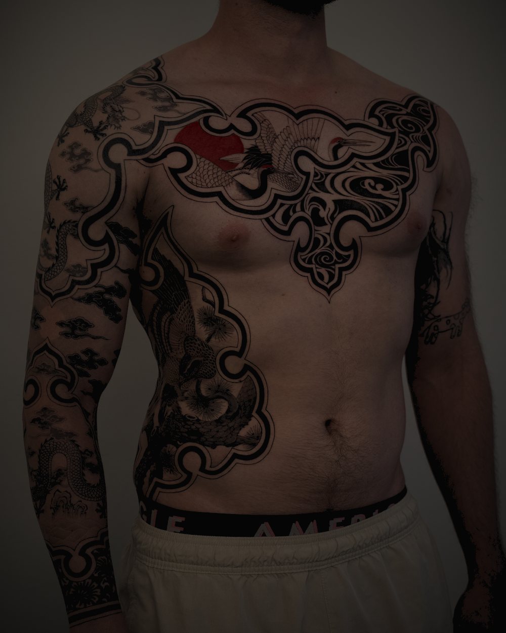 SAKI’s work — cranes and clouds across the chest and side